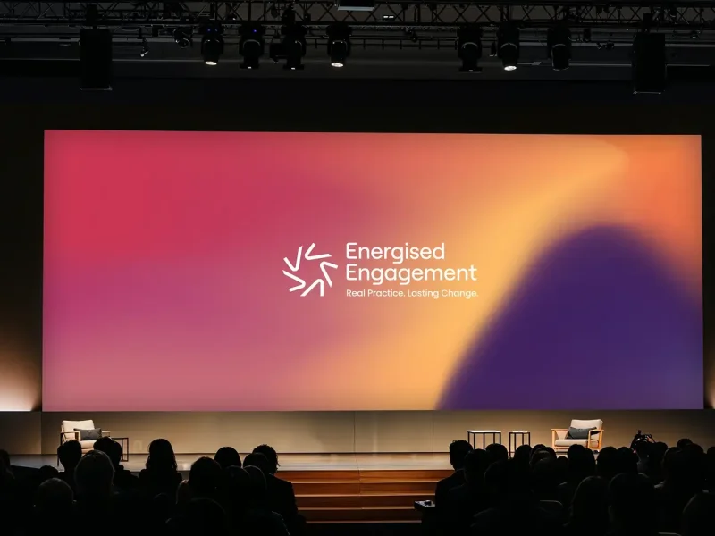 Conference screen with logo and gradient animation