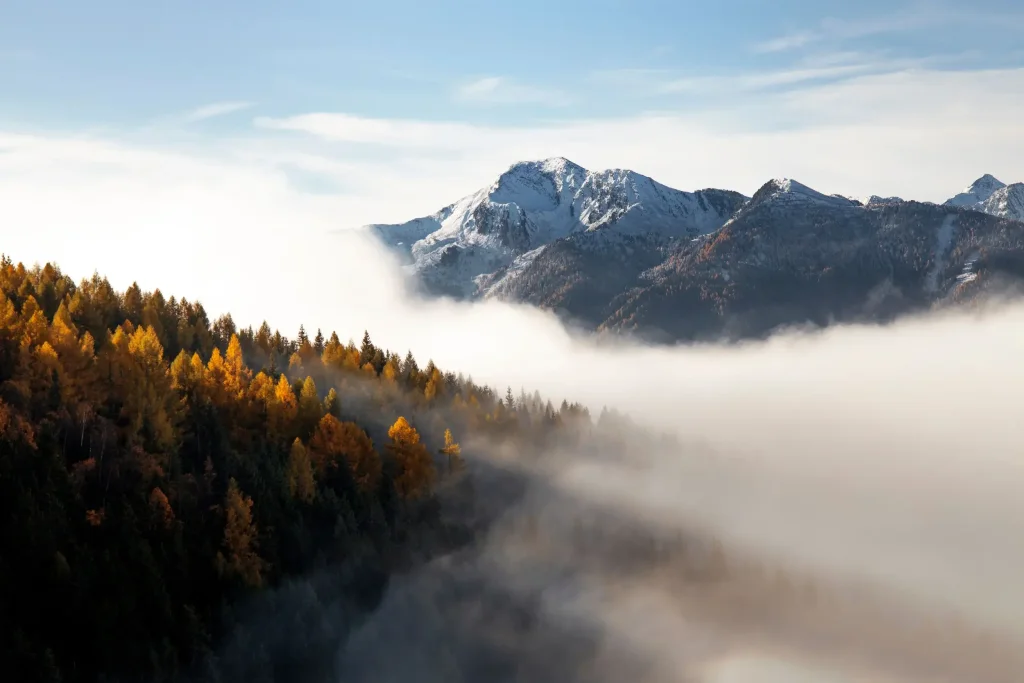 Fog clearing over valley.